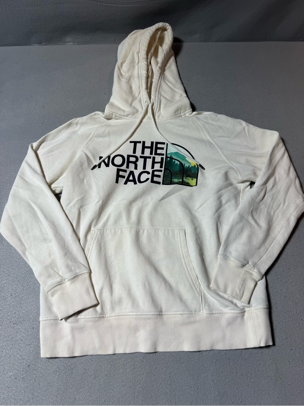 The North Face Cream Crewneck Hoodie with Green Mountain Graphic
